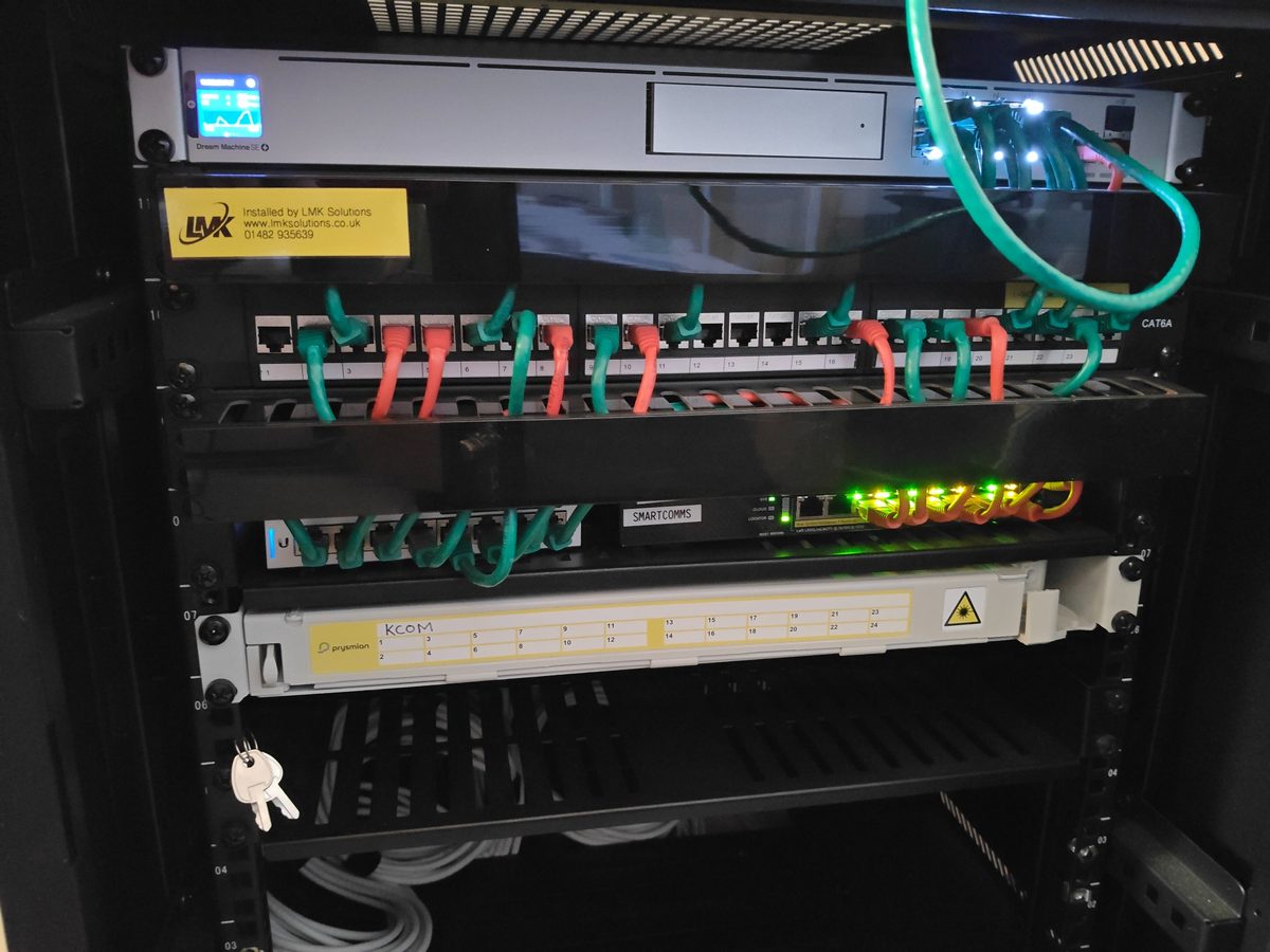 Business network cabinet with managed switching and structured cabling